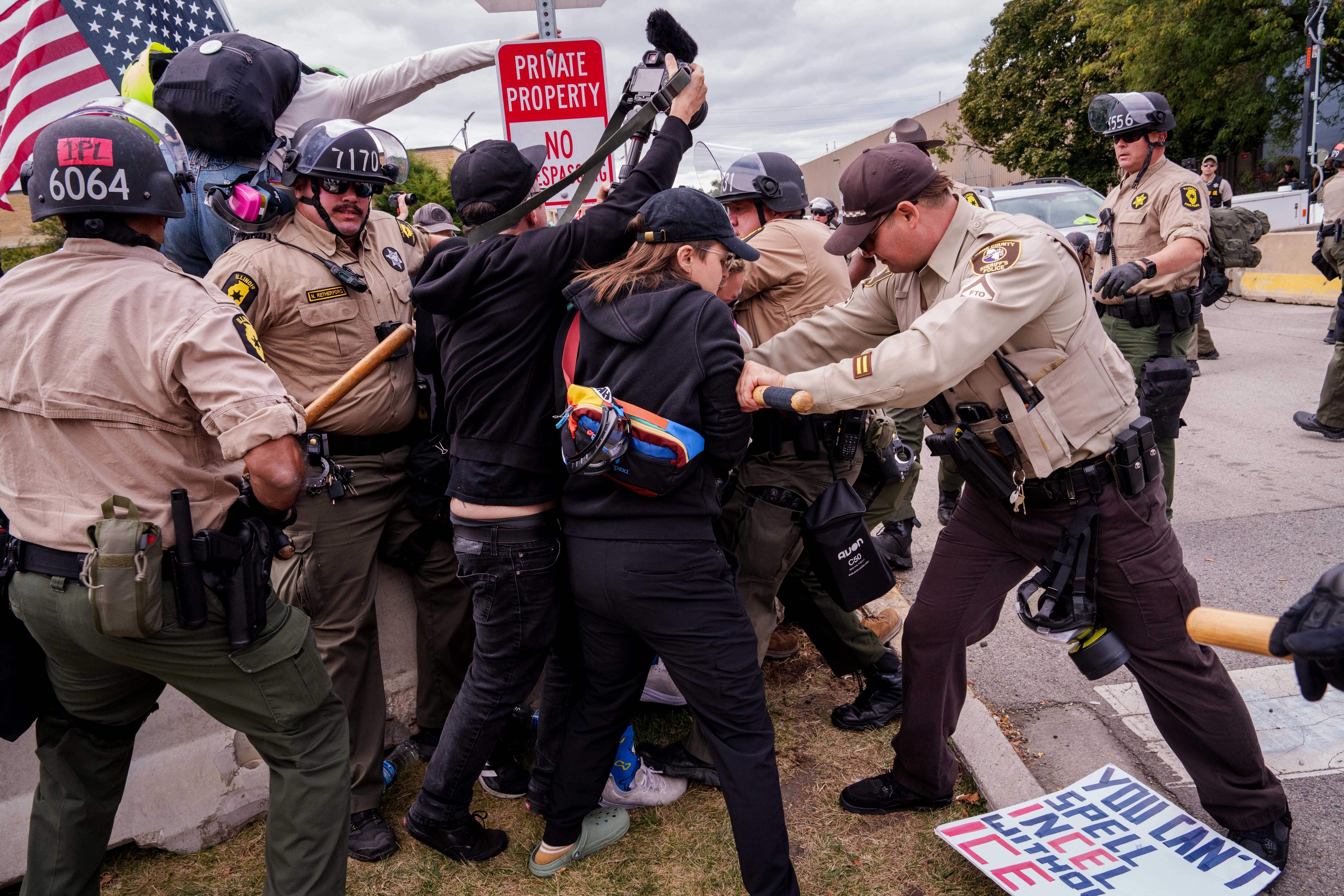 Illinois State Police and Cooks County Sheriffs move in to detain protesters outside the U.S. Immigration and Customs Enforcement facility in Broadview, Ill., Saturday, Oct. 11, 2025. (AP Photo/Adam Gray)