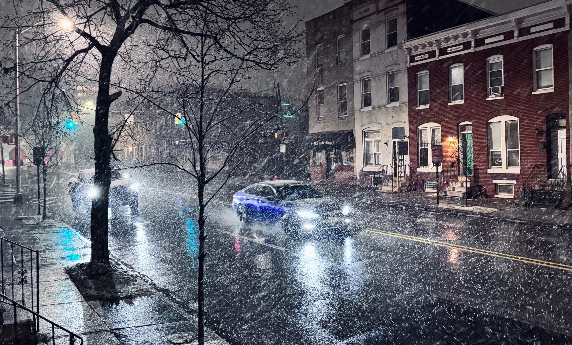Snow falls in the late night / early morning hours of February 17, 2024 in East Baltimore.
