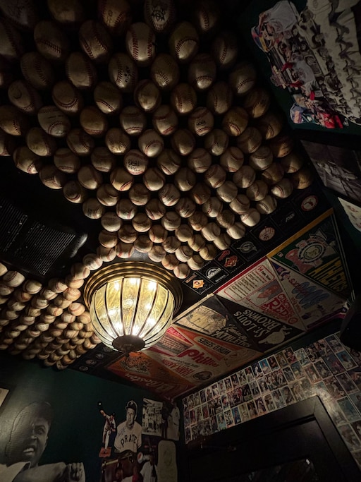 The ceiling of the baseball-themed bathroom at Eebee's is covered in ... baseballs.