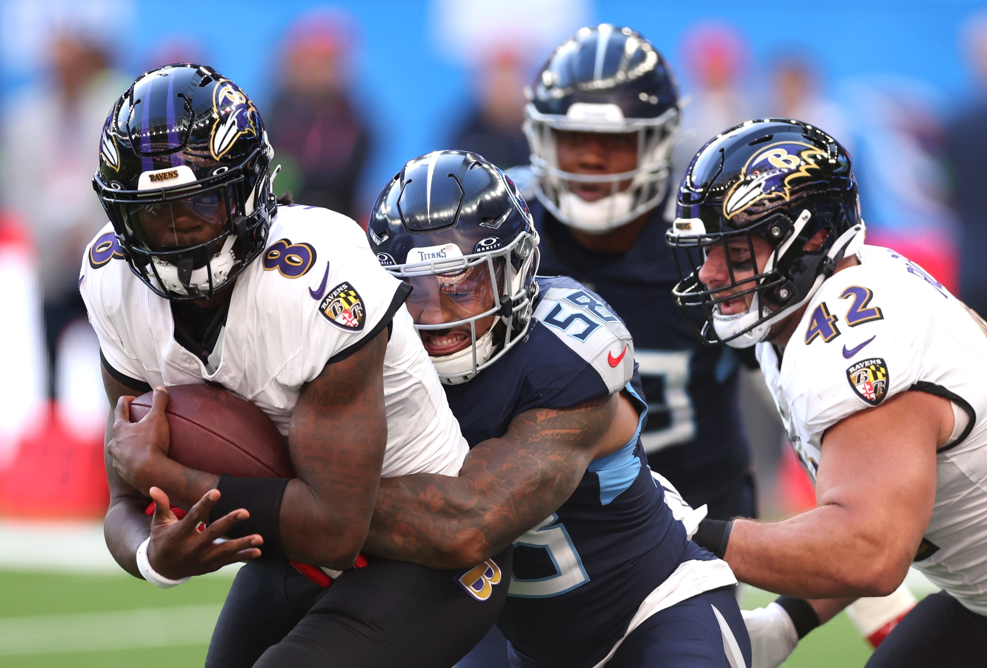 Lamar Jackson, #8 of the Baltimore Ravens, is sacked by Harold Landry III, #58 of the Tennessee Titans, in the second quarter during the 2023 NFL London Games match between Baltimore Ravens and Tennessee Titans at Tottenham Hotspur Stadium on Oct. 15, 2023 in London, England.