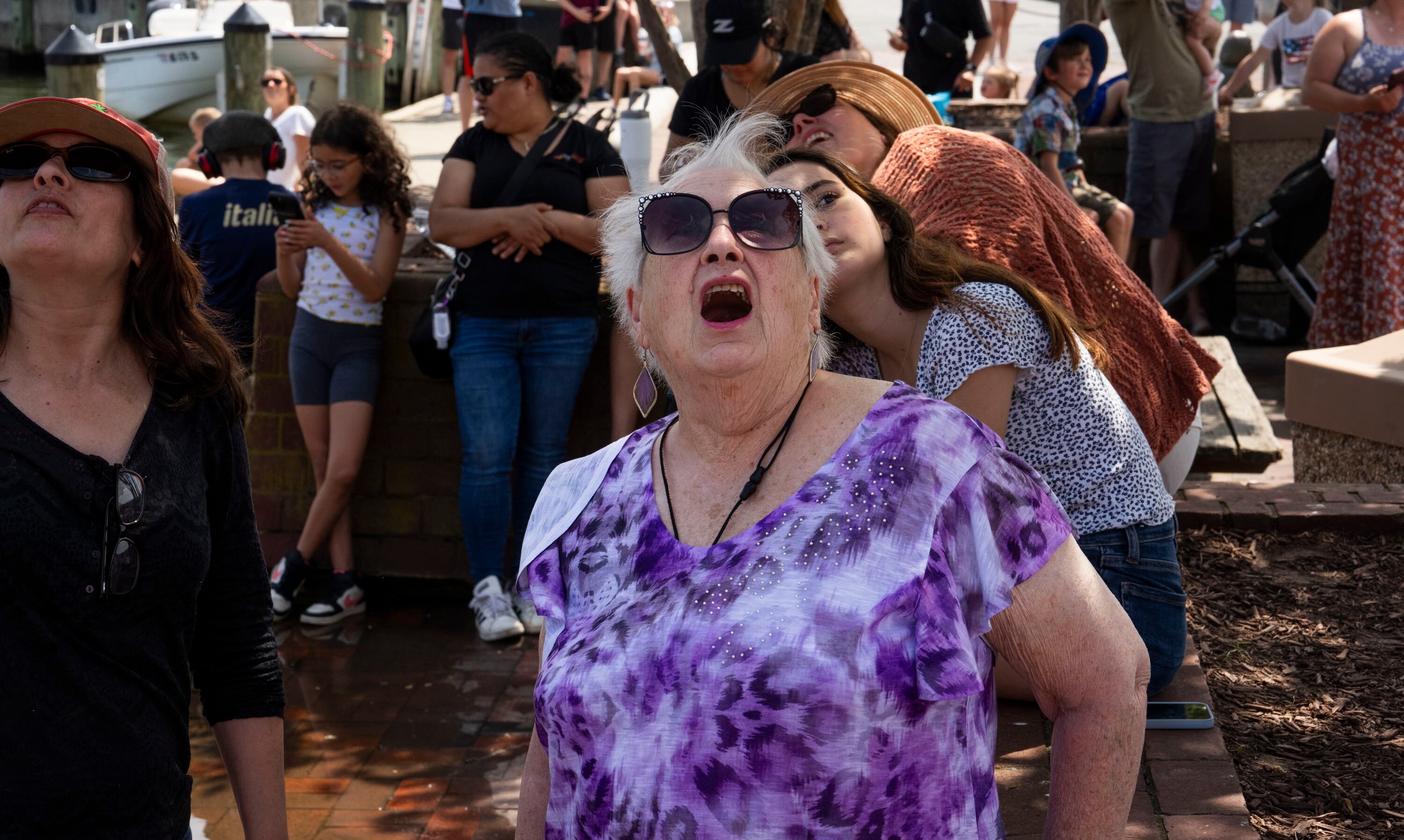 The Blue Angels complete their annual flyover above Annapolis during the Naval Academy’s commencement week on May 22, 2024. Gladys Schultz looks up in awe at the jets as they do stunts in the air.