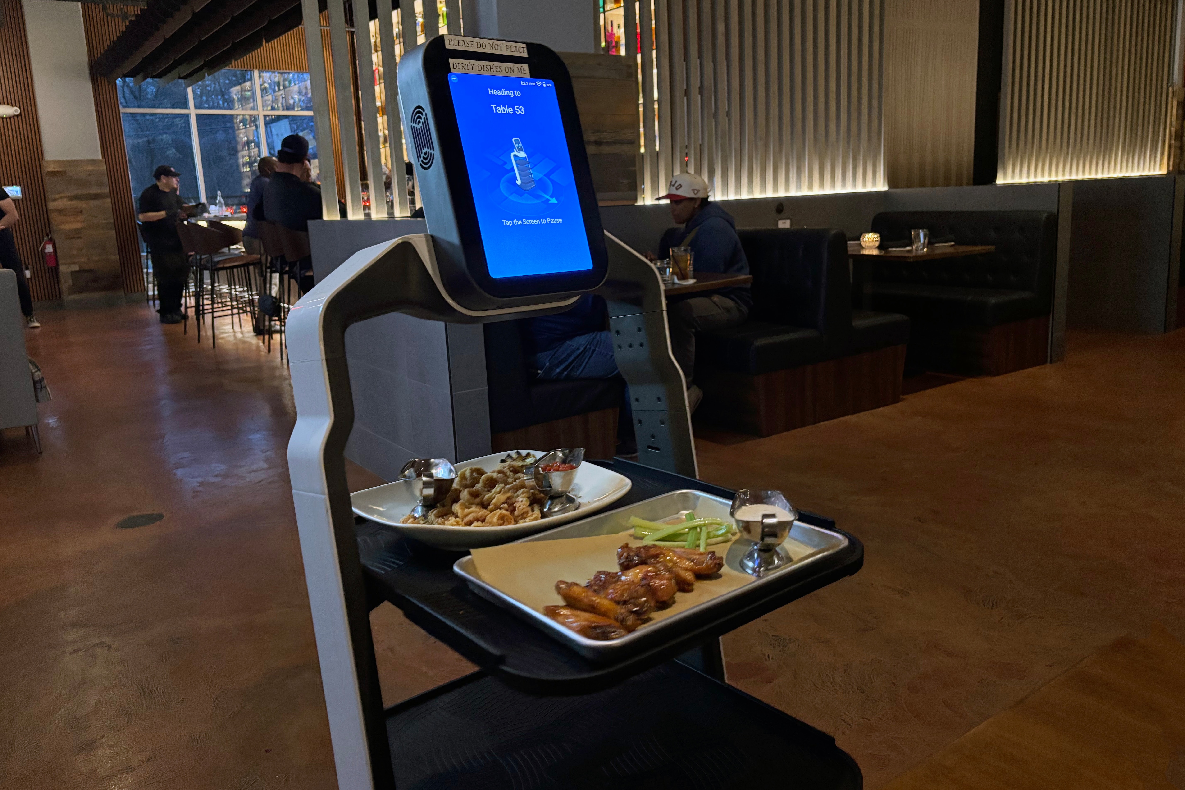 Robot waiters run drinks and plates to the booths at ViVa Ristorante, which opened in Elkridge in December.