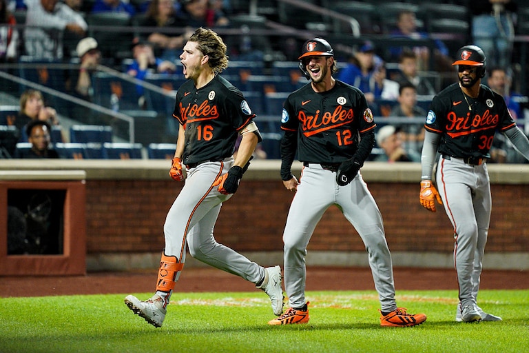 Orioles designated hitter Coby Mayo reacts after crossing home plate on his inside-the-park three-run home run against the New York Mets in the eleventh inning.