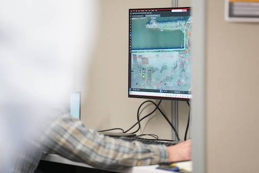 An engineer goes over schematics during a tour of the office where engineers work on the design for the new Francis Scott Key Bridge project, located in an Anne Arundel County business park, on Tuesday, December 16, 2025.