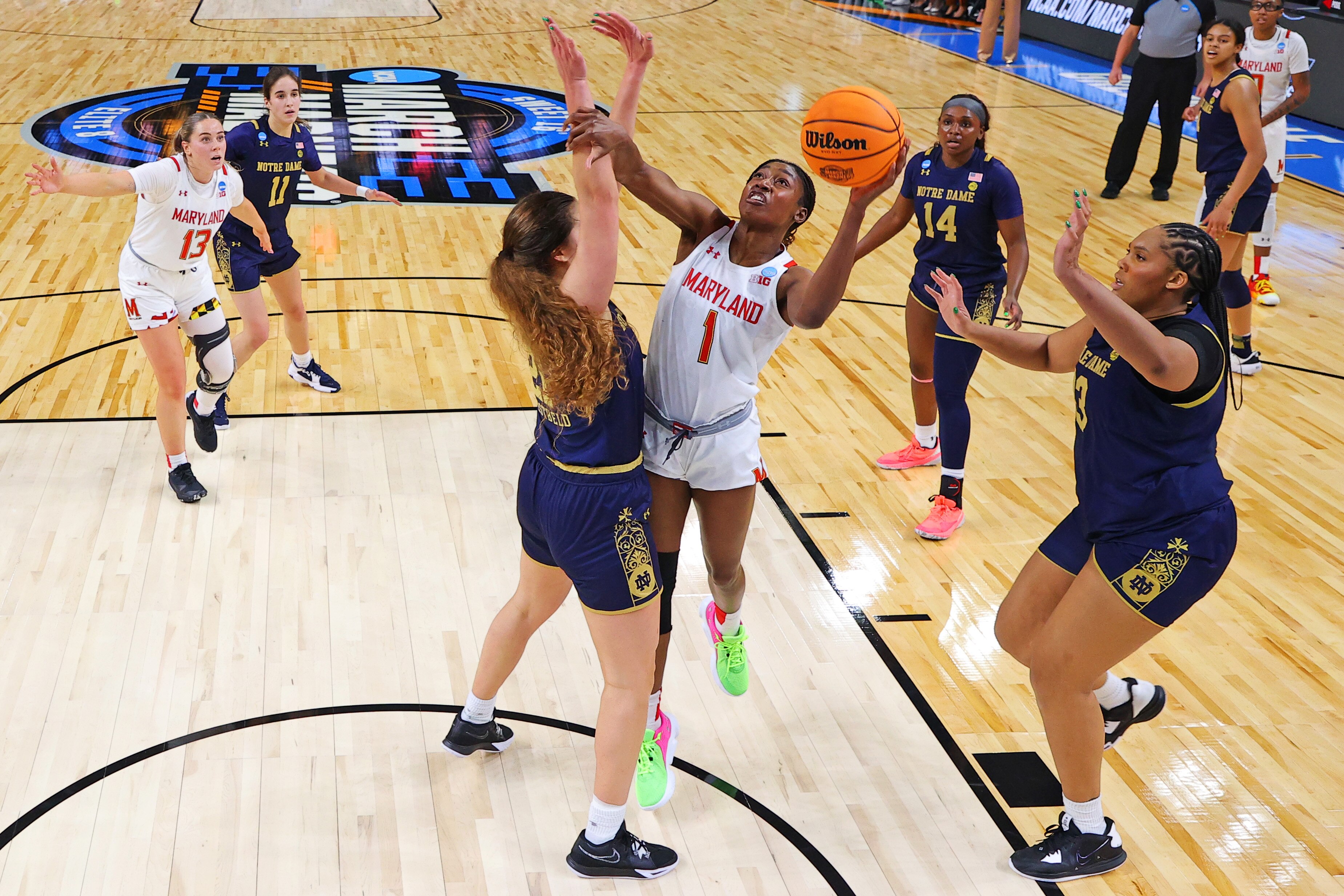 Diamond Miller #1 of the Maryland Terrapins shoots the ball against Maddy Westbeld #21 of the Notre Dame Fighting Irish during the second half in the Sweet 16 round of the NCAA Women's Basketball Tournament at Bon Secours Wellness Arena on March 25, 2023 in Greenville, South Carolina.