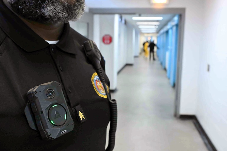 Sgt. Shawn Elliott of Baltimore’s Central Booking & Intake Center wears a body camera in the halls of the facility. The Maryland Department of Public Safety and Correctional Services recently rolled out body cameras to all guards across the state’s prisons.