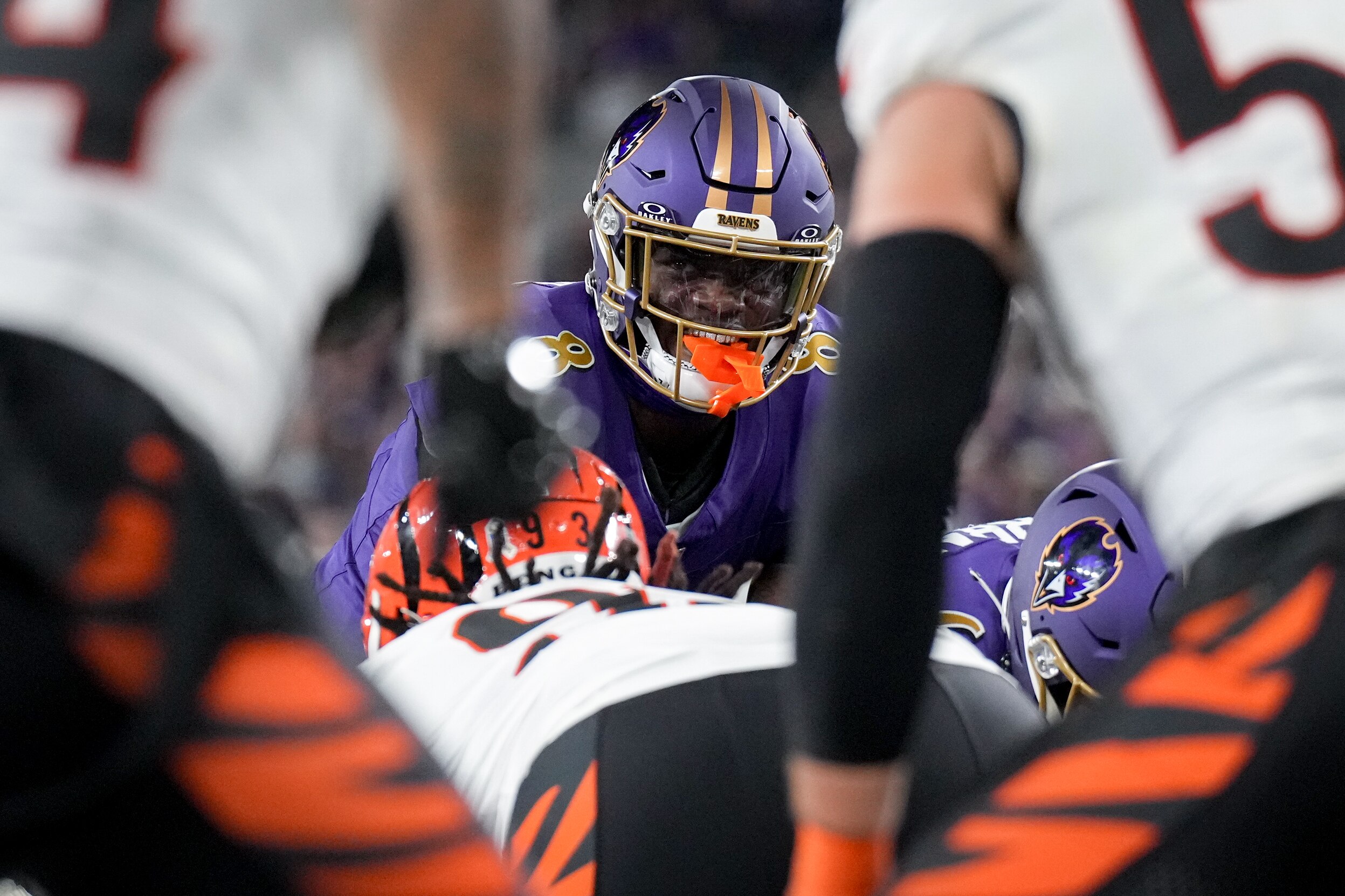 Baltimore Ravens quarterback Lamar Jackson (8) smiles before handing the ball off to Derrick Henry for a touchdown during a Thursday Night Football game against the Cincinnati Bengals at M&T Bank Stadium in Baltimore, Md., on November 7, 2024. The Baltimore Ravens won, 35-34.
