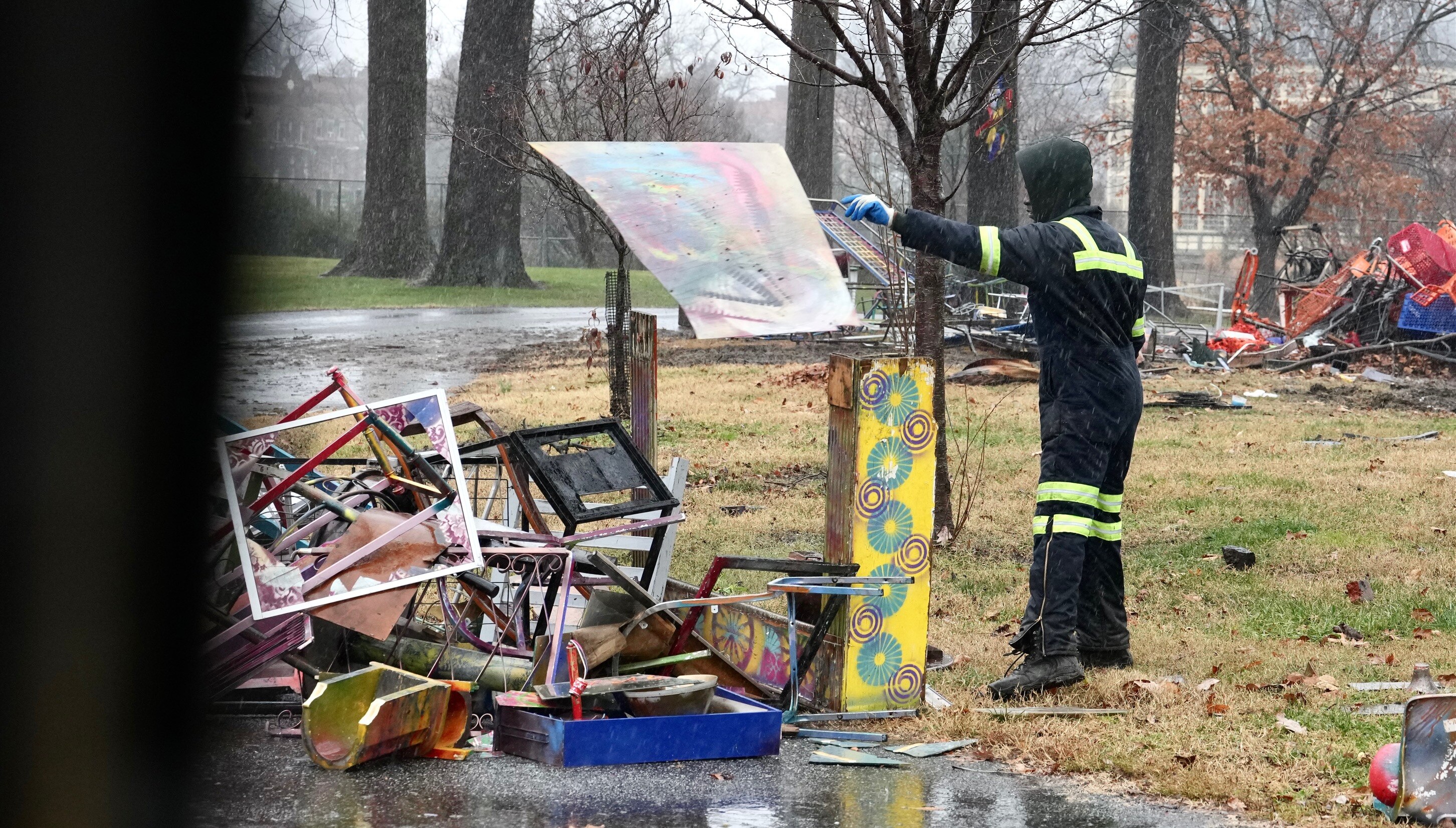 Employees with Baltimore's Department of Public Works demolish Colin Williams' art exhibit in Druid Hill Park on Thursday, Dec. 15.
