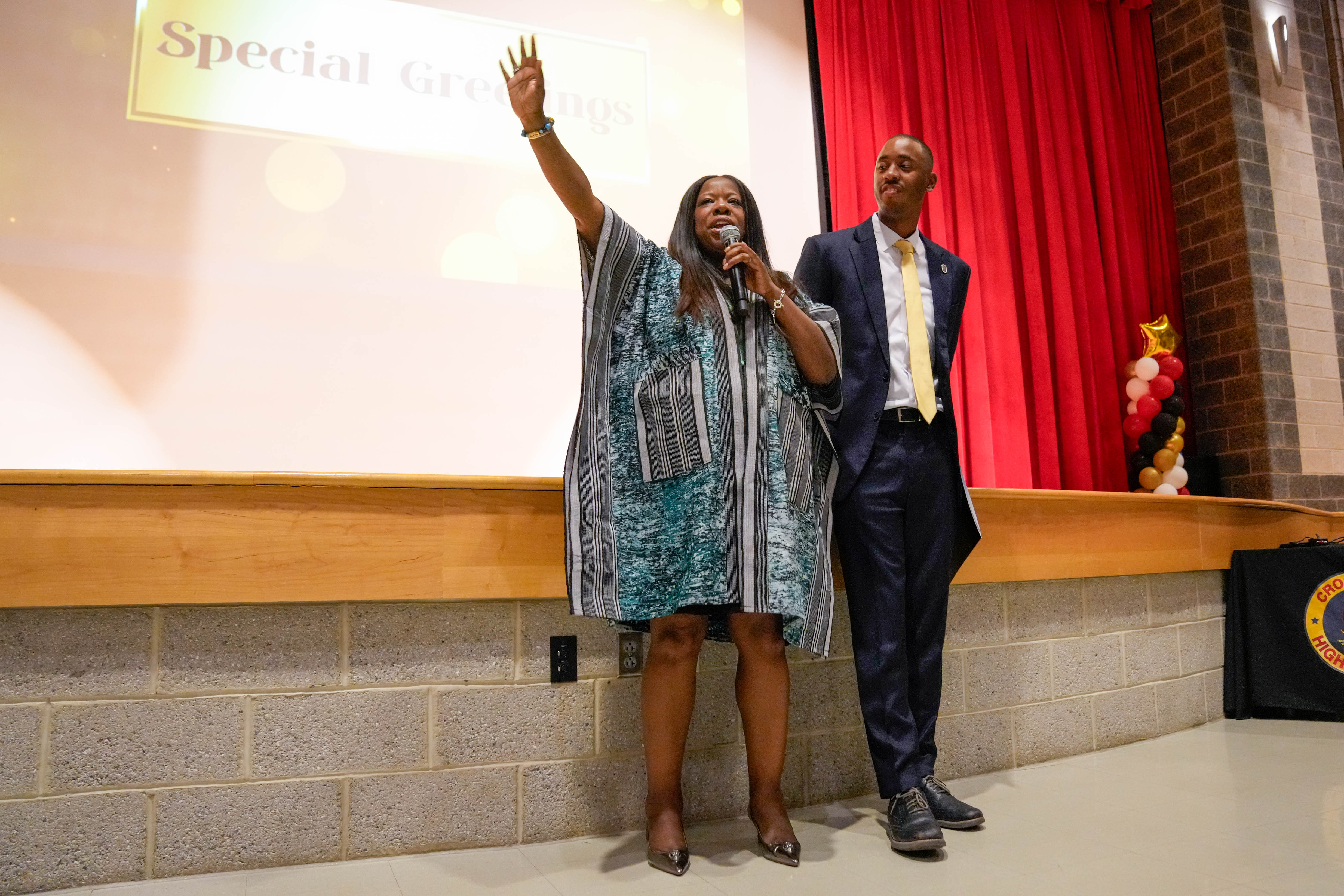 From left, Prince George’s County Executive Aisha Braveboy and County Council member Edward Burroughs as she gives remarks during at an event at Crossland High School in Camp Springs earlier this month.