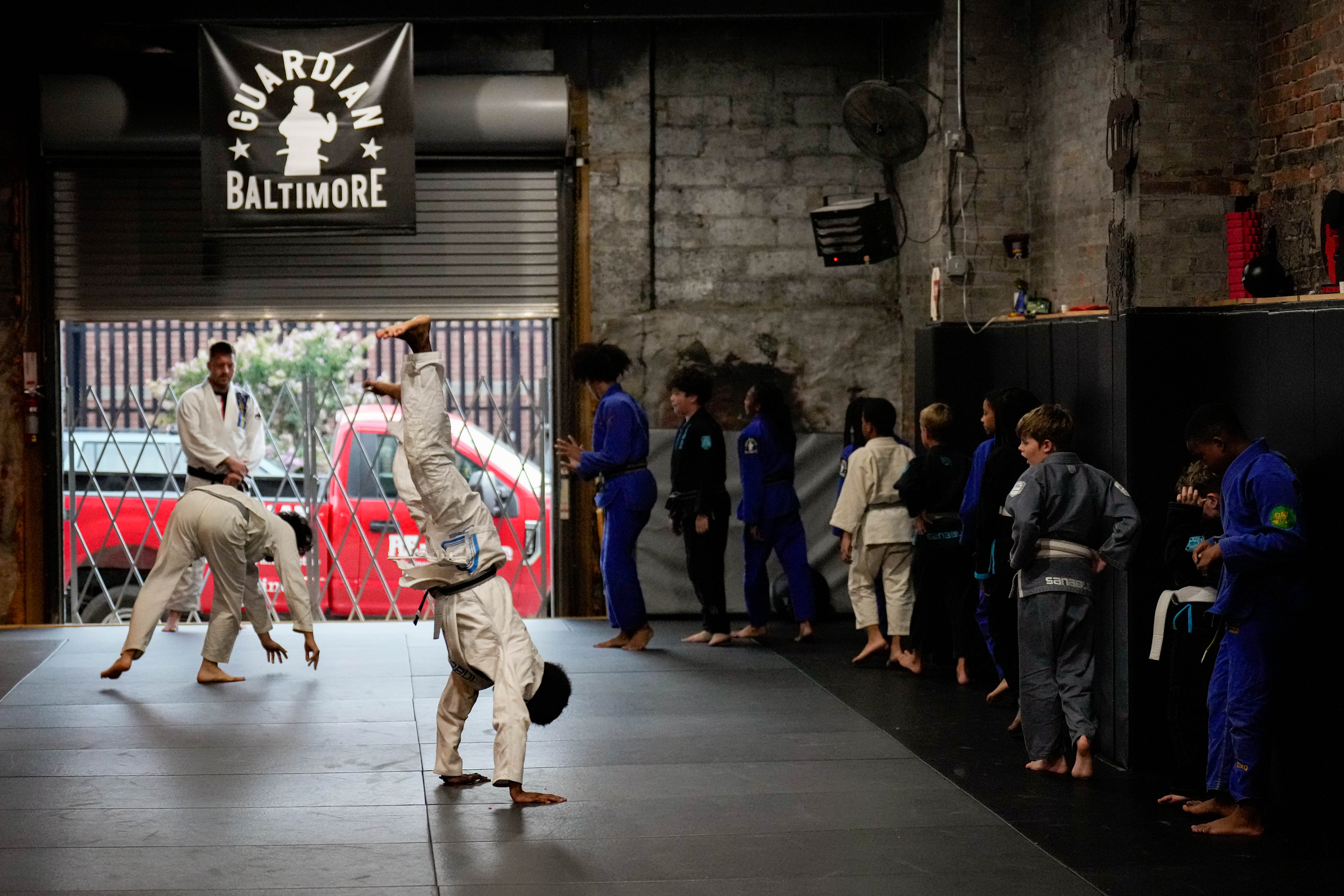 A jiu jitsu lesson taking place at Guardian Baltimore, a non-profit martial arts studio, in Baltimore.