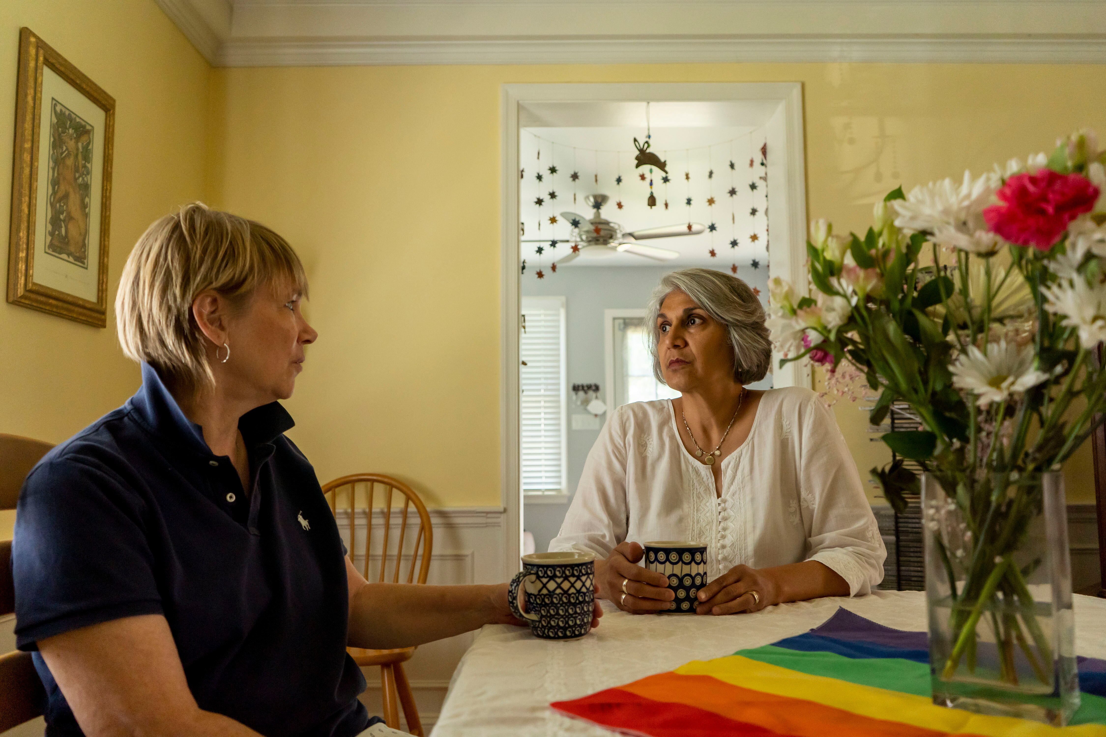 Gita Deane and Lisa Polyak sit and chat in their home in Baltimore.