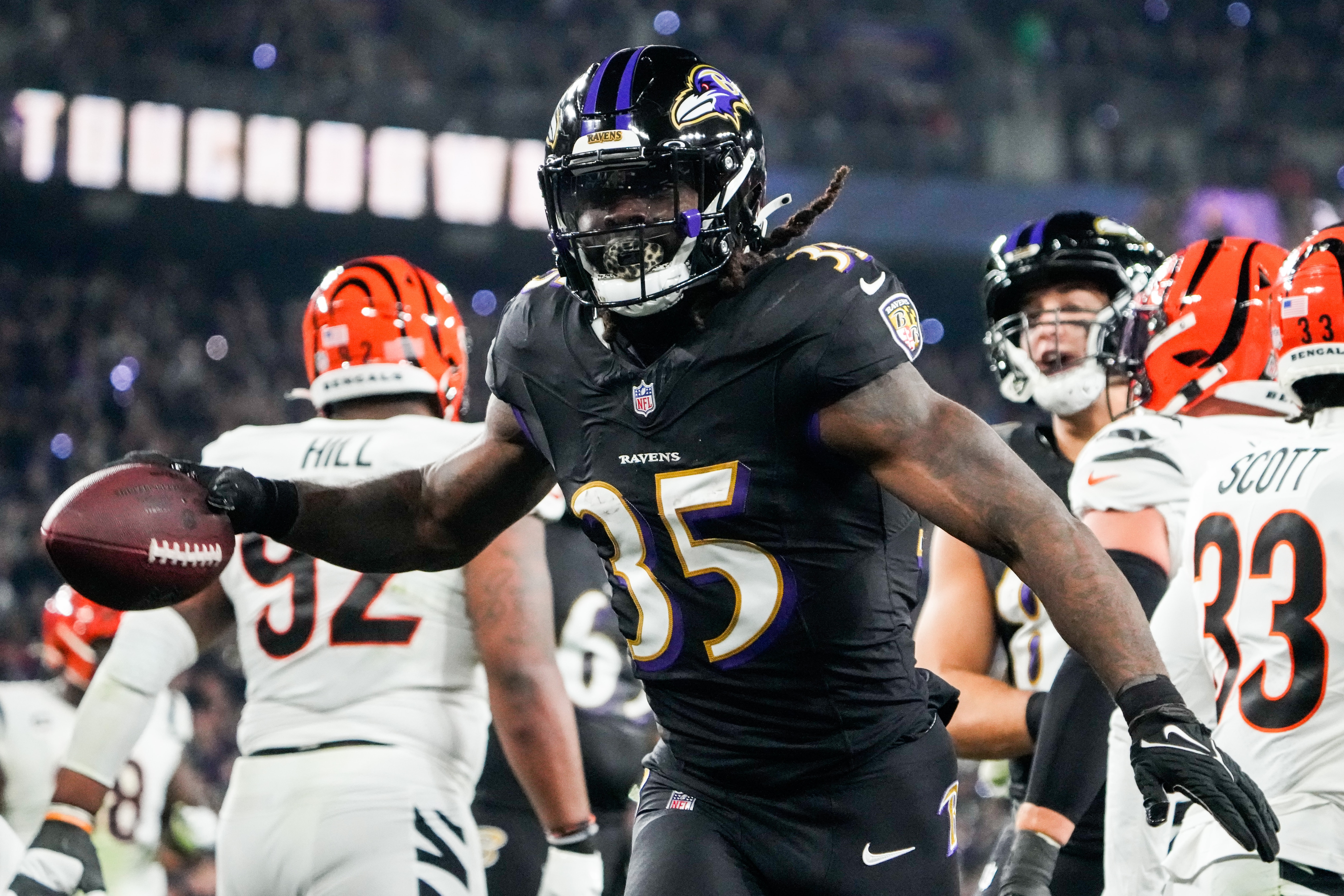 Baltimore Ravens running back Gus Edwards (35) celebrates after scoring a touchdown during the first quarter against the Cincinnati Bengals at M&T Bank Stadium on Thursday, Nov. 16, 2023.
