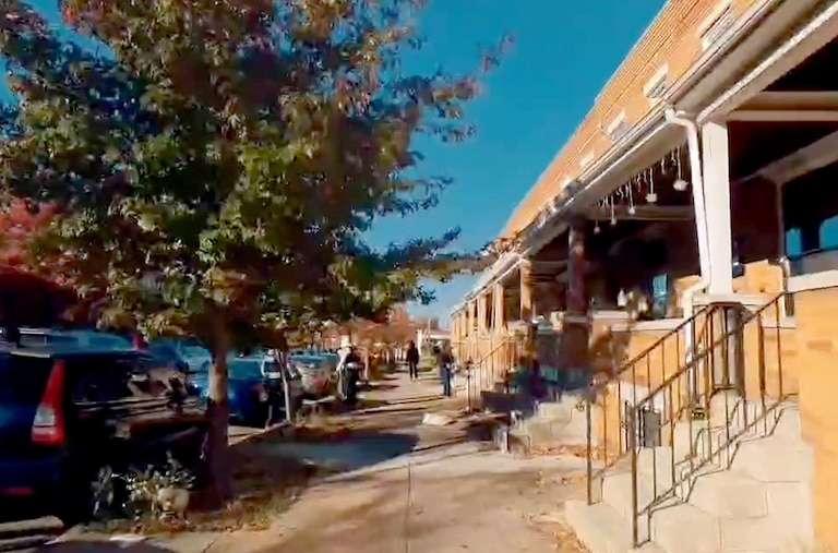 A still from a video from Baltimore residents as they move to confront apparent immigration agents on a Southeast Baltimore residential street Sunday morning.