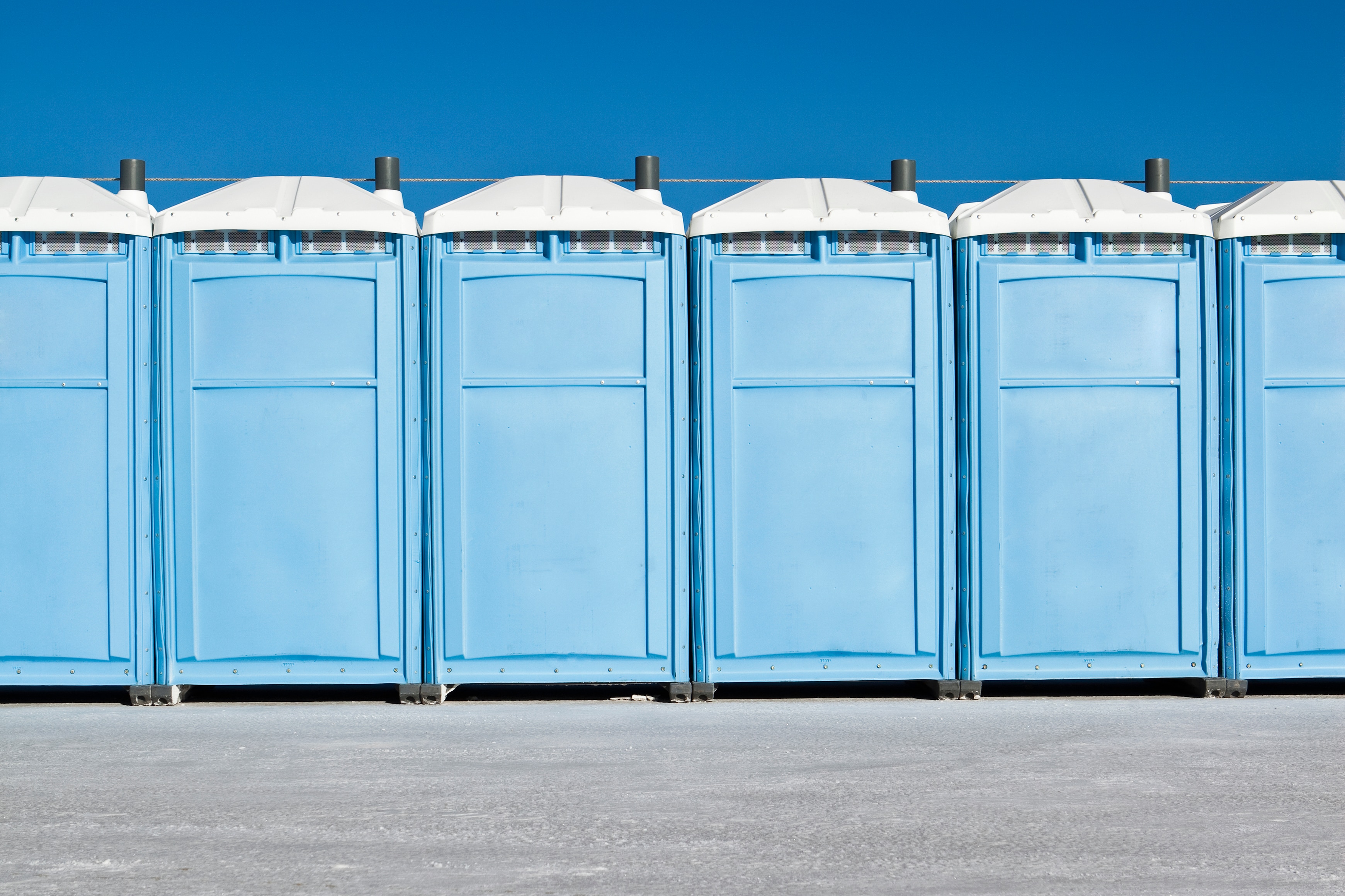 Row of portable toilets.