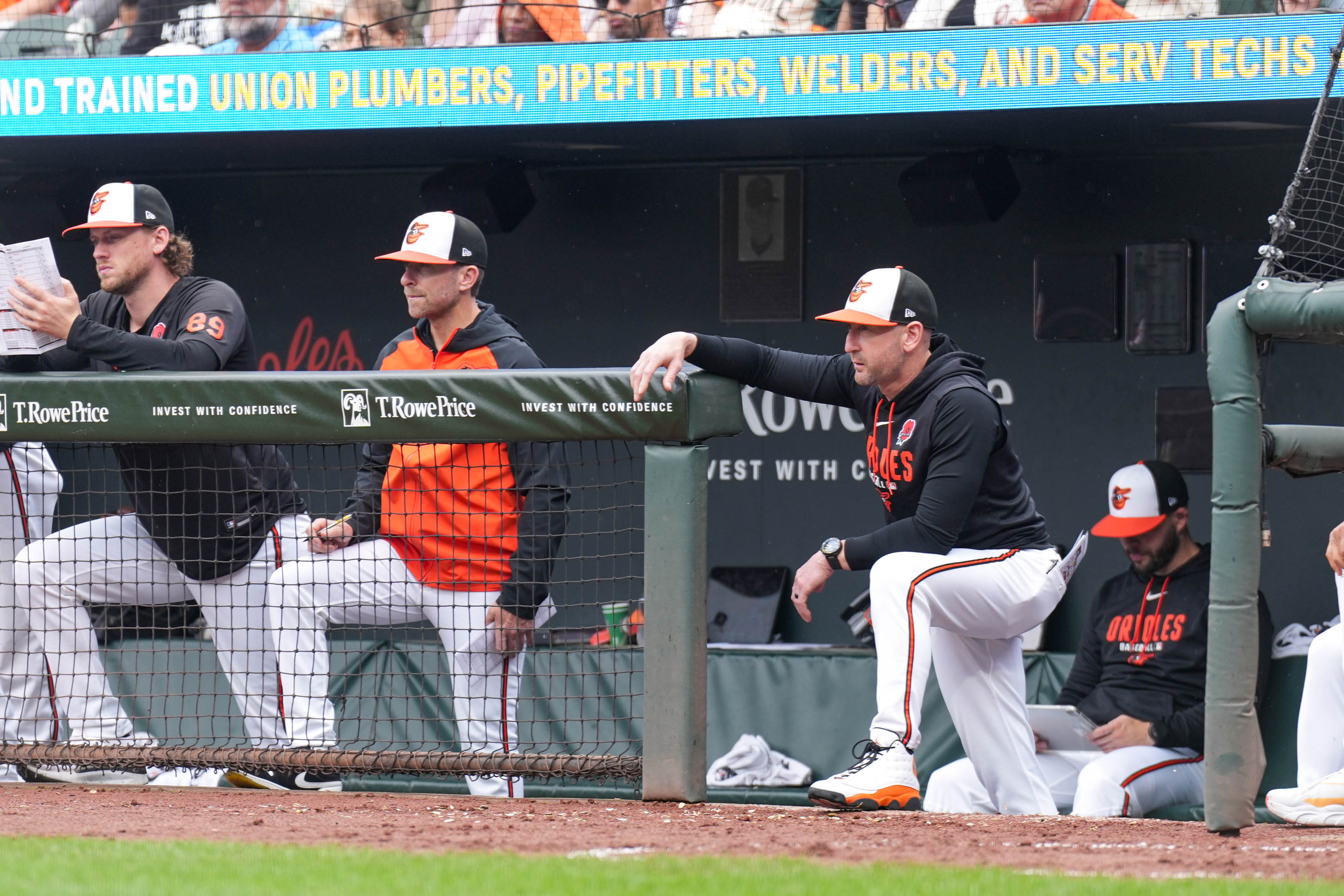 Orioles manager Craig Albernaz, second from right, watches from the dugout during Monday's game against the Tampa Bay Rays.