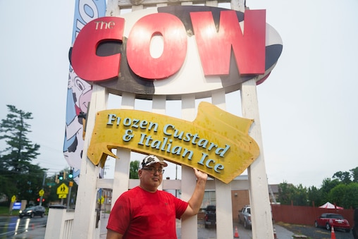 Owner Mike Reiner stands in front of his storeβs recognizable sign at The Cow ice cream shop in Reistertown, Md. on July 1, 2025.