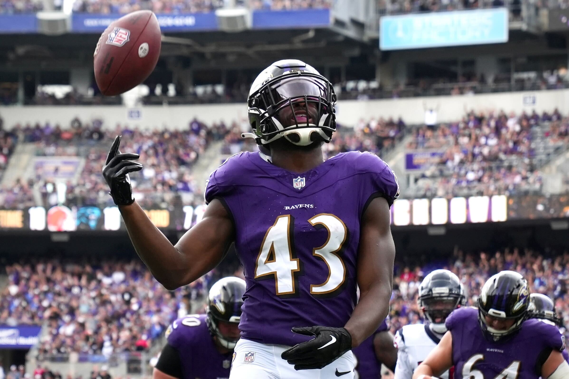 Ravens running back Justice Hill rushes for a touchdown in the third quarter against the Houston Texans in the season opener at M&T Bank Stadium.
