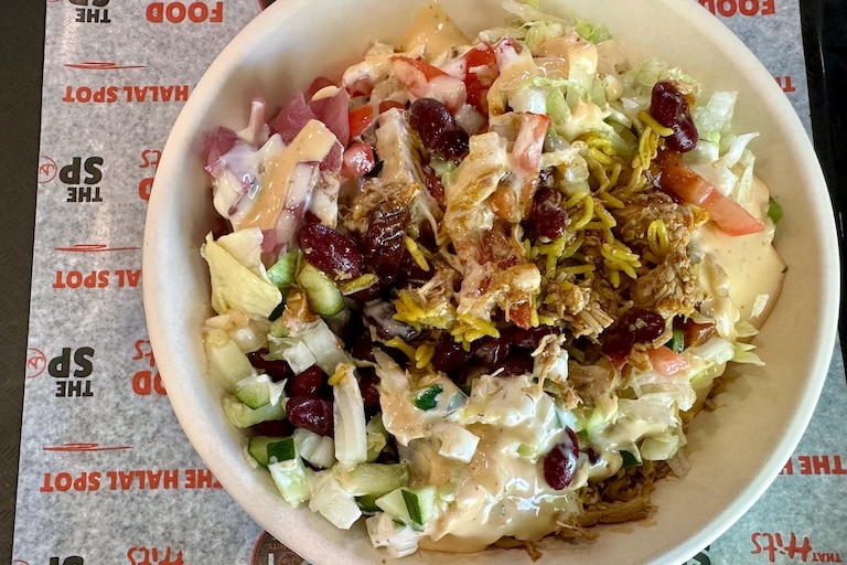 The build-your-own rice bowl at The Halal Spot in Owings Mils includes your choice of rice, meat, sauces and toppings.