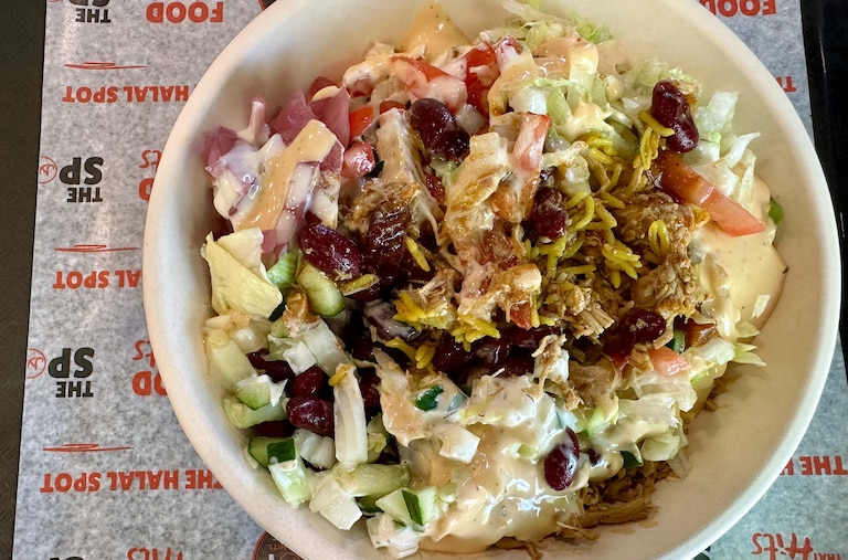 The build-your-own rice bowl at The Halal Spot in Owings Mils includes your choice of rice, meat, sauces and toppings.