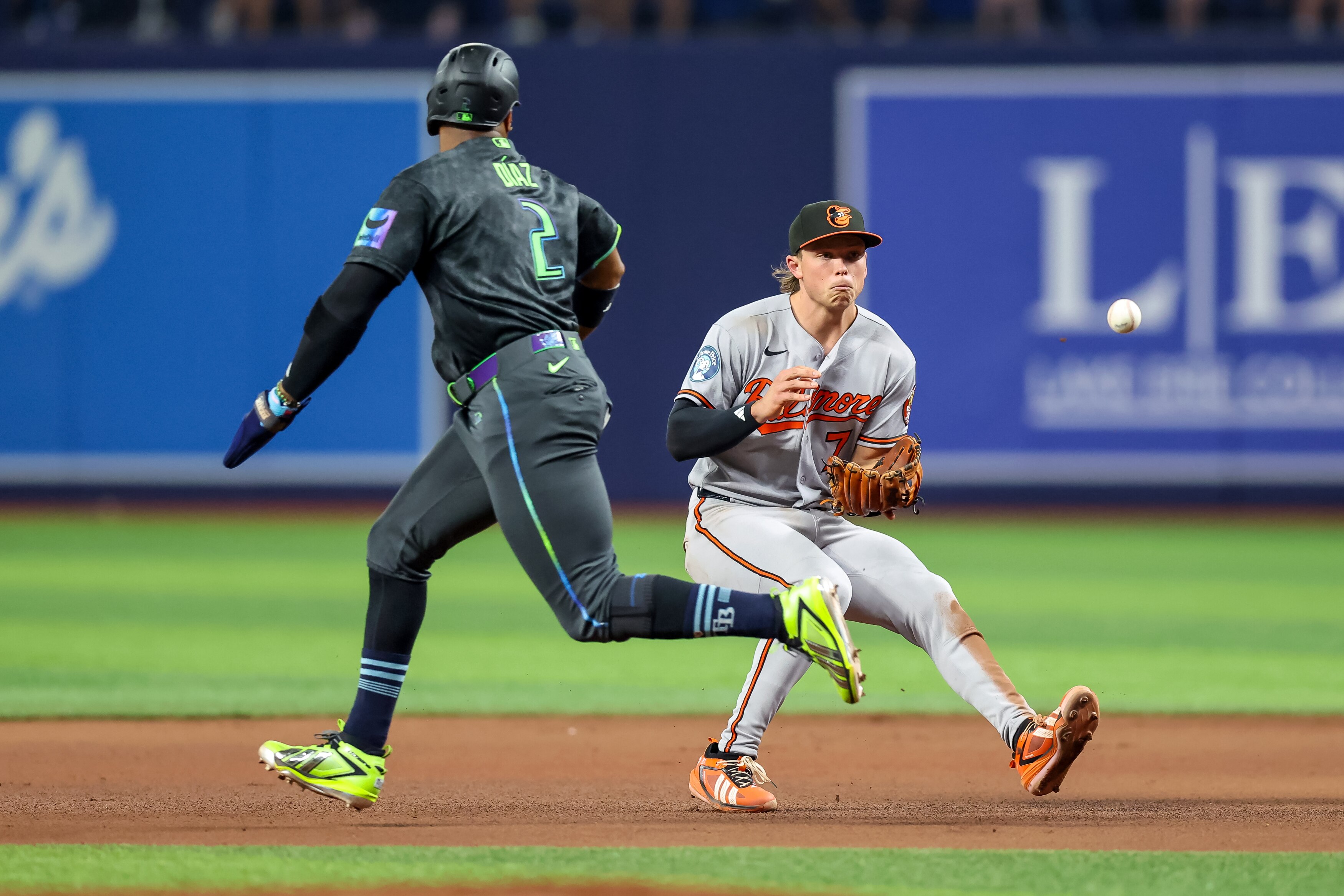 Jackson Holliday fields a ground ball as the Rays’ Yandy Díaz runs by during the seventh inning Saturday night.