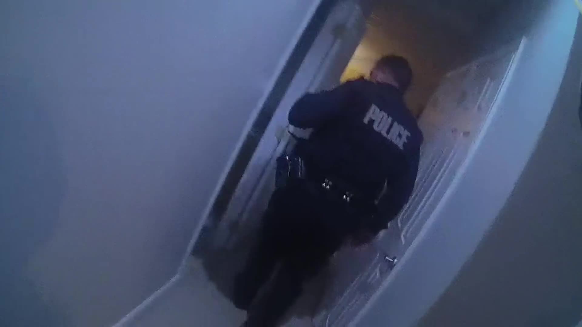 John Linthicum lead the way down into the basement, ahead of police.