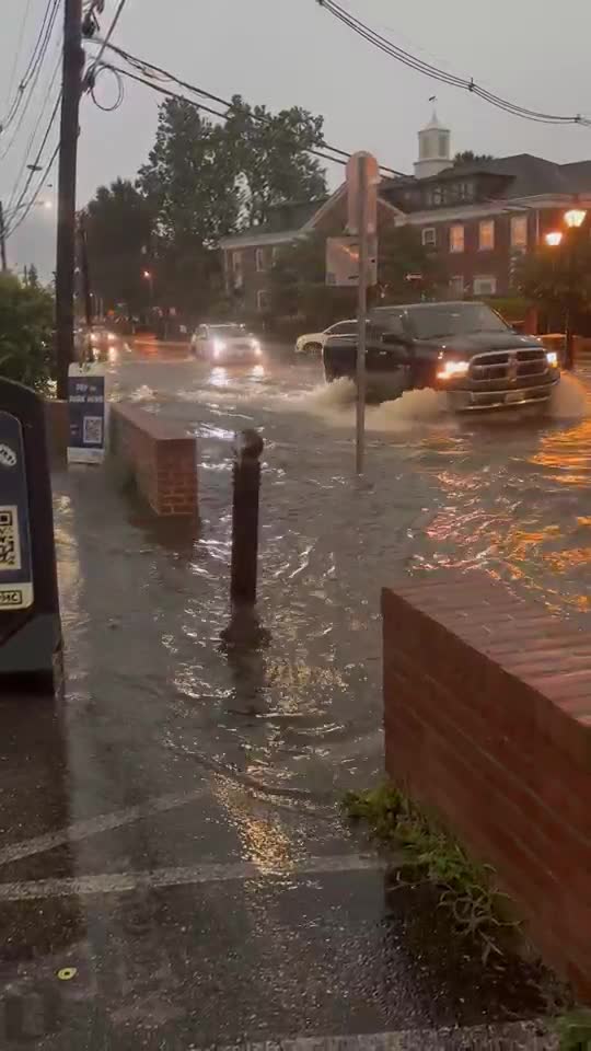 Cars driving along Compromise Street in Annapolis on Wednesday, July 9, 2025, after a downpour.