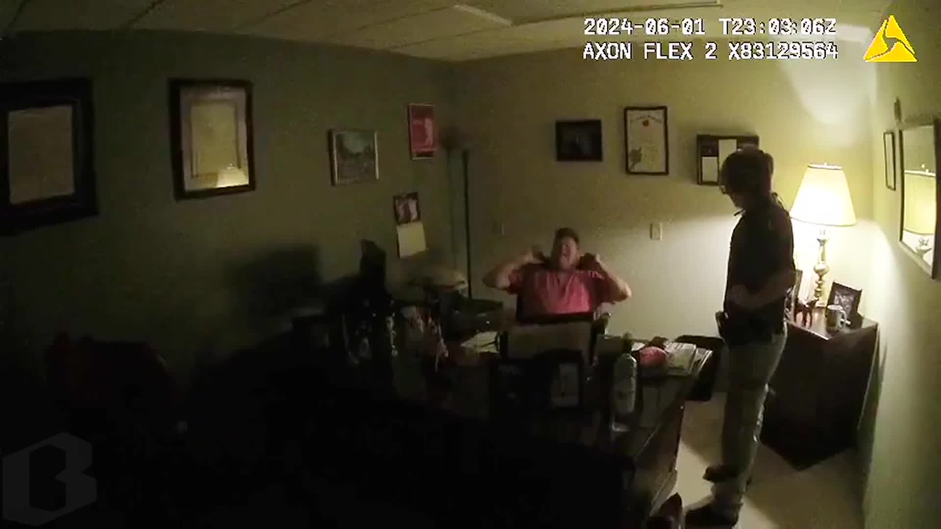 Seen in Sgt. Charles Bagley's bodycam, Crandell opens a drawer to reveal a gun.