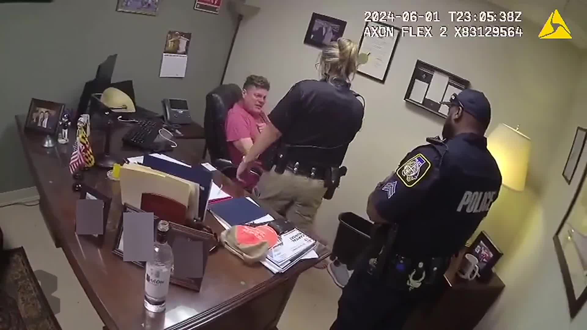 Officers move to arrest Crandell after efforts to deescalate.