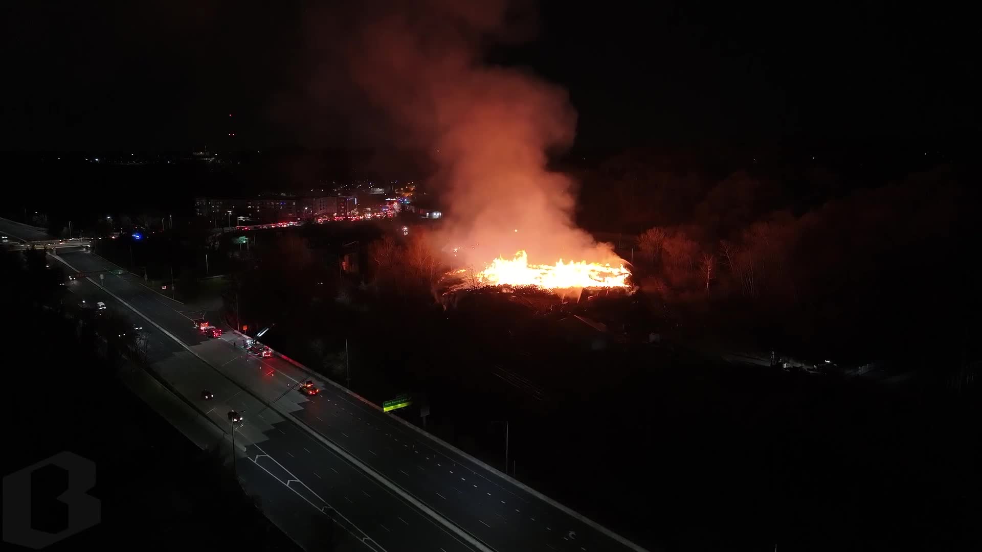 The southbound lanes of I-83 are shut down as a massive fire burns nearby at the Camp Small city wood recycling facility.